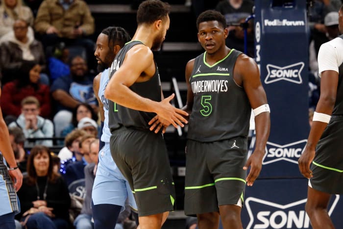 Nov 26, 2023; Memphis, Tennessee, USA; Minnesota Timberwolves guard Anthony Edwards (5) reacts with forward-guard Kyle Anderson (1) during the second half against the Memphis Grizzlies at FedExForum.